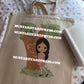 sad girl doll tote bag