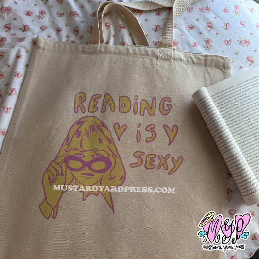 reading is sexy tote bag