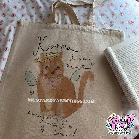 karma cat tote bag